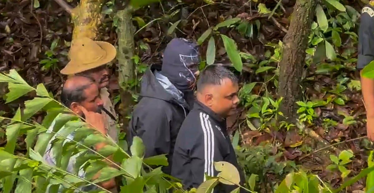 PTI Photo : Senior security officials at the office of the SIT constituted to probe the case related to the alleged mass burial in Dharmasthala 