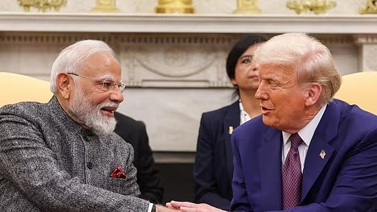 PTI : US President Donald Trump (R) with PM Narendra Modi (L)