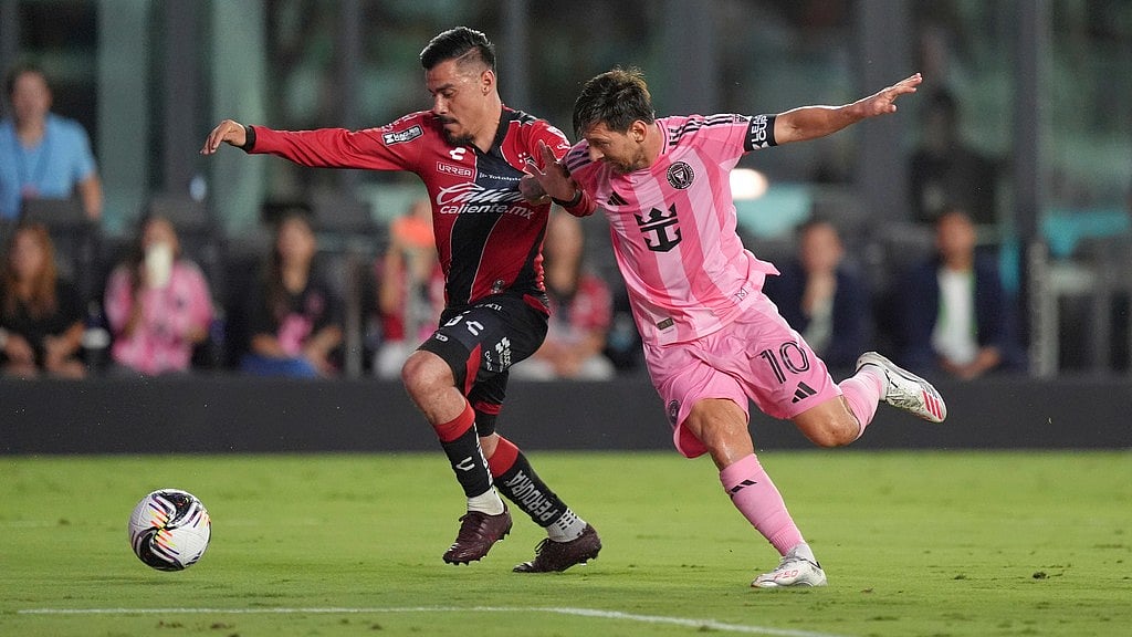 AP/Rebecca Blackwell : Inter Miami forward Lionel Messi (10) vies with Atlas midfielder Aldo Rocha during the first half of a Leagues Cup group stage soccer match.