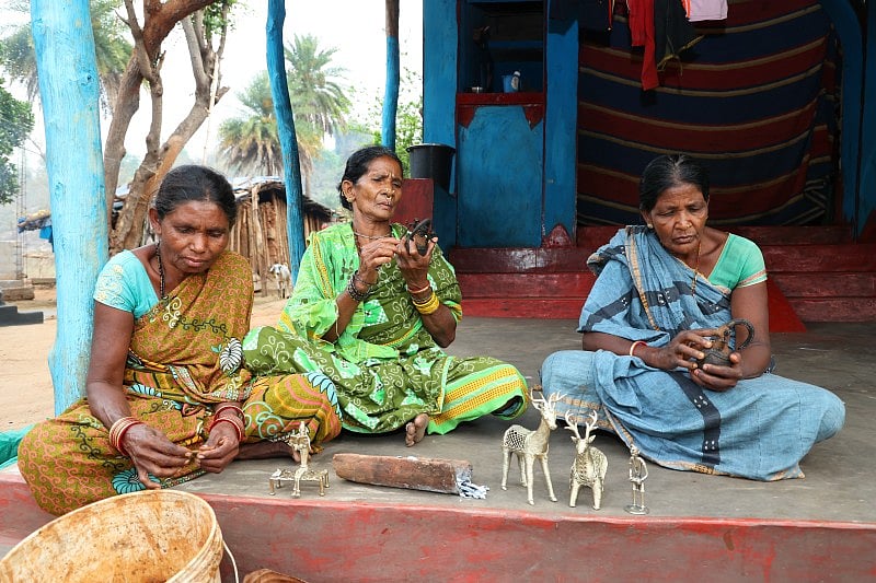 Three women are doing art and craft