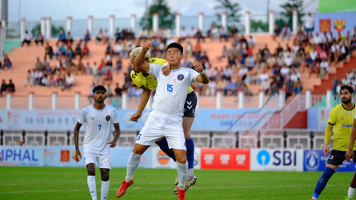 | Photo: Durand Cup/KUNAL BAGCHI                                                                                                                                                                                                                                                    : Indian Navy FT vs Real Kashmir FC, Durand Cup 2025: Indian Navy's Novin Gurung fights for the ball with Real Kashmir's Marat Tarek during the Group F fixture.