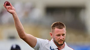 AP/Kirsty Wigglesworth : England's Gus Atkinson celebrates with the ball after gets five wickets during the second day of the fifth Test.