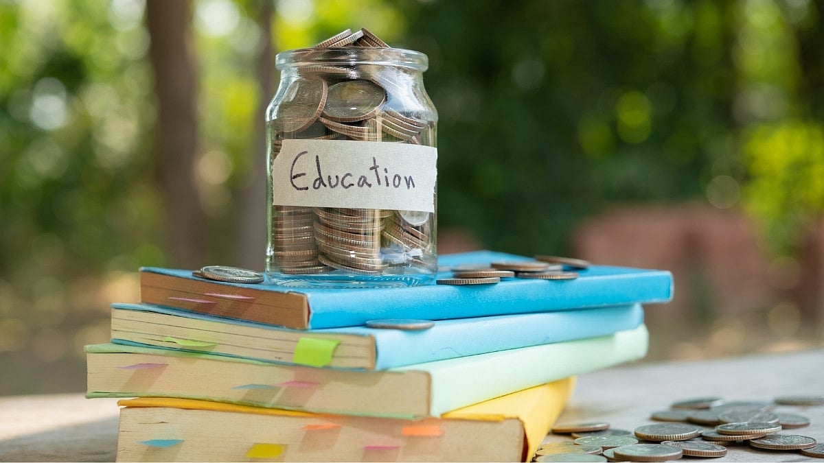 Jar of coins labeled Education on books