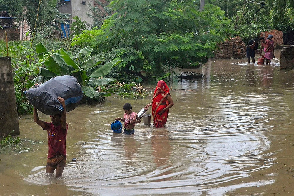 | Photo: PTI : Ganga river inundates an area in Mirzapur