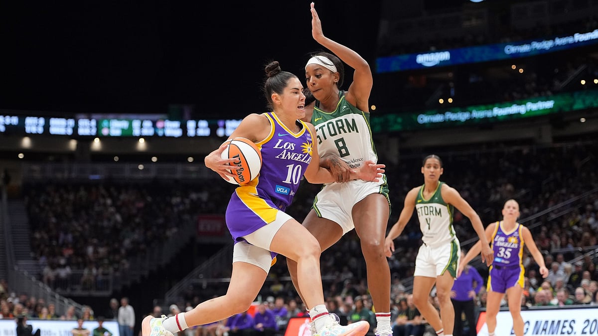 Kelsey Plum #10 of the Los Angeles Sparks goes to the basket against Lexie Brown #8 of the Seattle Storm during the first half at Climate Pledge Arena on August 01, 2025 in Seattle, Washington.