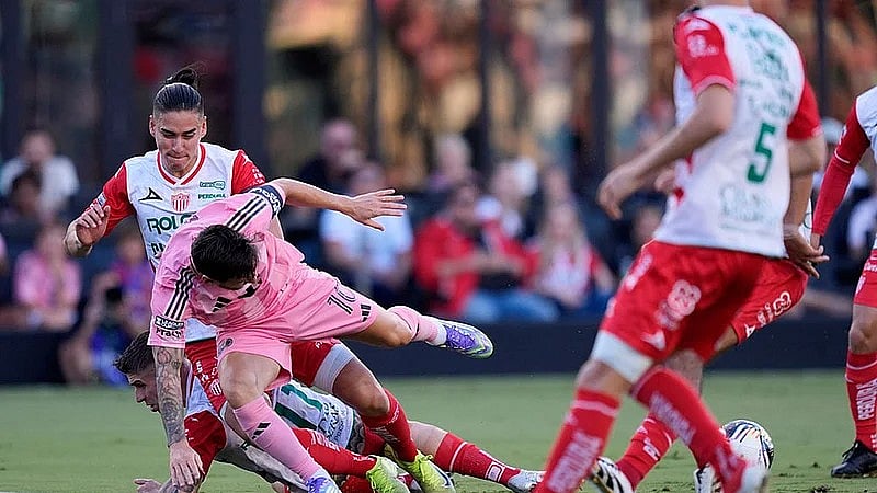 Photo: AP : Sports Highlights, August 3: Inter Miami forward Lionel Messi (10) takes a tumble in a clash with Necaxa defenders Alexis Pena, top, and Cristian Calderon, bottom, during a Leagues Cup match.