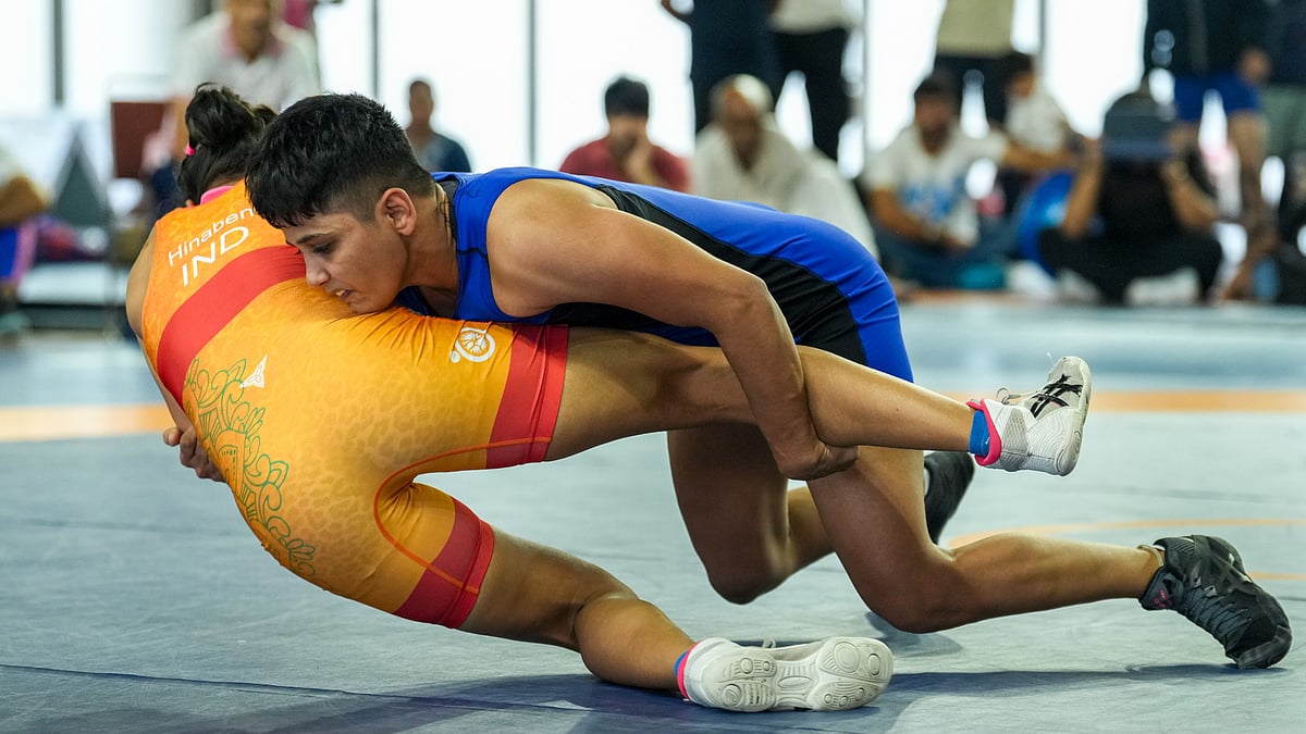 PTI : Antim Panghal, blue, and Hinaben compete in the 53 kg event during trials for the World Wrestling Championships 2025 in New Delhi.