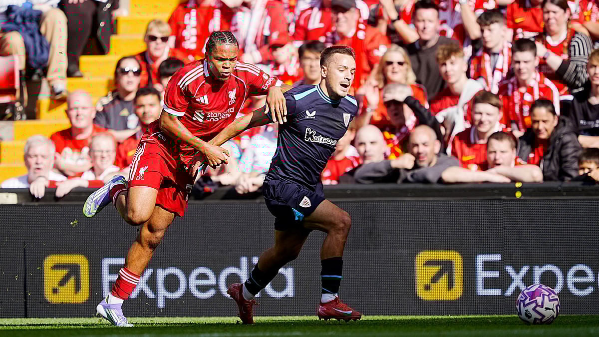 (Peter Byrne/PA via AP) : Liverpool's Rio Ngumoha (left) and Athletic Bilbao's Andoni Gorosabel vie for the ball during the pre-season friendly soccer match between Liverpool and Athletic Bilbao, at Anfield, Liverpool, England, Monday Aug. 4, 2025.