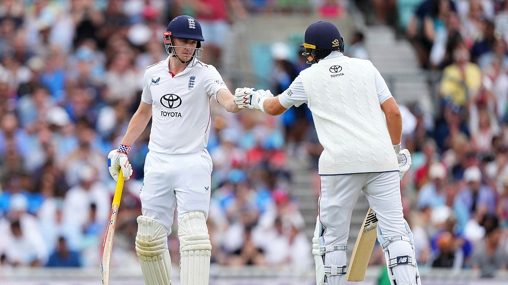 AP/Kirsty Wigglesworth : England's Harry Brook, left, greeted by Joe Root