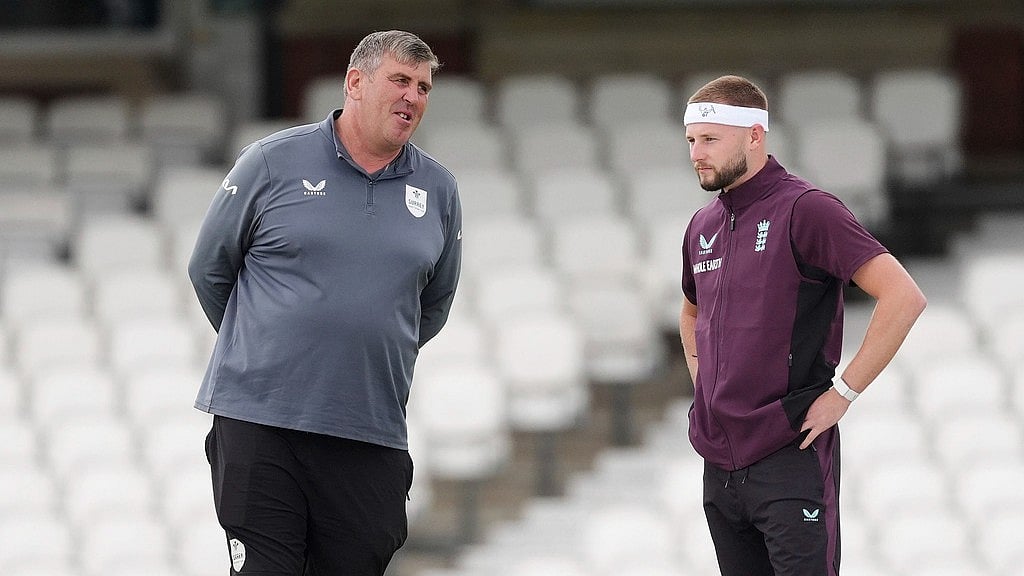 AP/Ben Whitley : England's Gus Atkinson with Oval head groundsman Lee Fortis, left, during a nets session at the Kia Oval