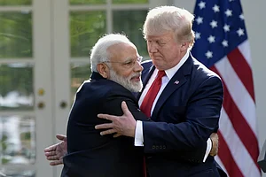 AP : US President Donald Trump (R) with PM Modi (R)