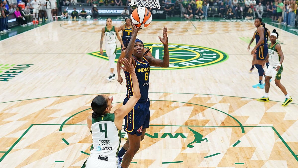 Natasha Howard #6 of the Indiana Fever shoots over Skylar Diggins #4 of the Seattle Storm during the second half at Climate Pledge Arena on August 03, 2025 in Seattle, Washington.