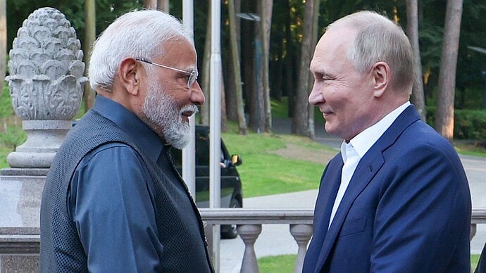PM Modi (L) with Russian President Vladimir Putin (R) - PTI