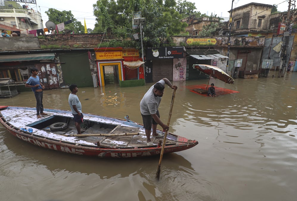 PTI : Boats on street due to flooding in Varanasi.
