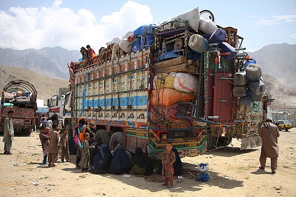Haroon Sabawoon/Anadolu Agency/Getty Images : Afghan refugee families arrive at UNHCRs registration center as they return back to their country after spending more than three decades in neighbor Pakistan, at outskirt of Kabul, Afghanistan on August 7, 2016. 