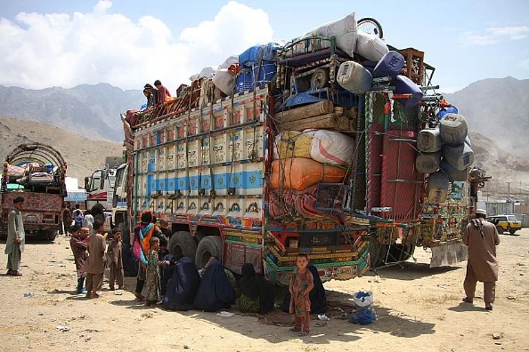 Afghan refugee families arrive at UNHCRs registration center as they return back to their country after spending more than three decades in neighbor Pakistan, at outskirt of Kabul, Afghanistan on August 7, 2016. - Haroon Sabawoon/Anadolu Agency/Getty Images