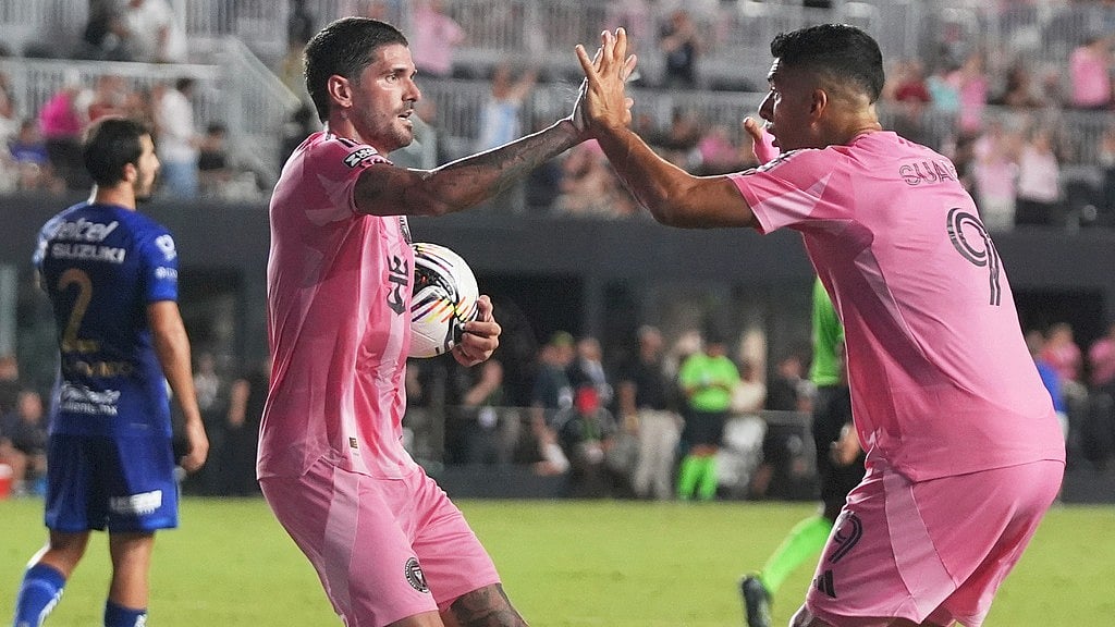 AP : Inter Miami midfielder Rodrigo De Paul, left celebrates with forward Luis Suarez (9) after scoring a goal during the first half of a Leagues Cup match against Pumas UNAM.