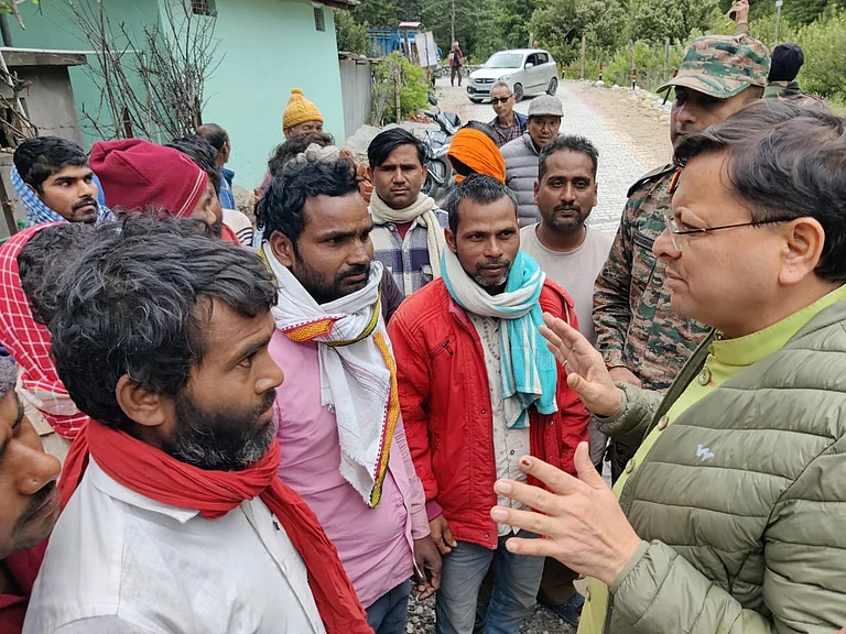 Uttarakhand CM Dhami interacting with locals after the disaster - File photo