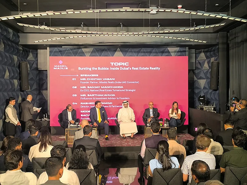 People seated on stage discussing cross-border investment strategy