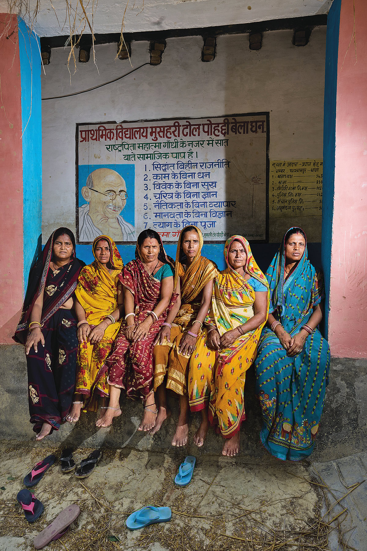 The She Voter : Women sitting outside a school in Pohaddi Bela village in Dharbhanga - Romana Manpreet