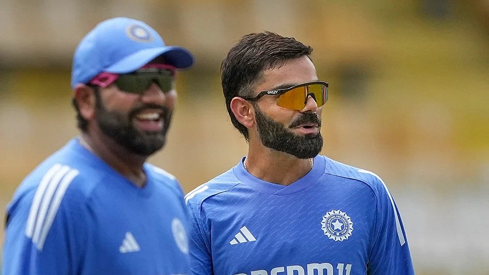 | Photo: PTI/Kunal Patil : Rohit Sharma and Virat Kohli during a training session.