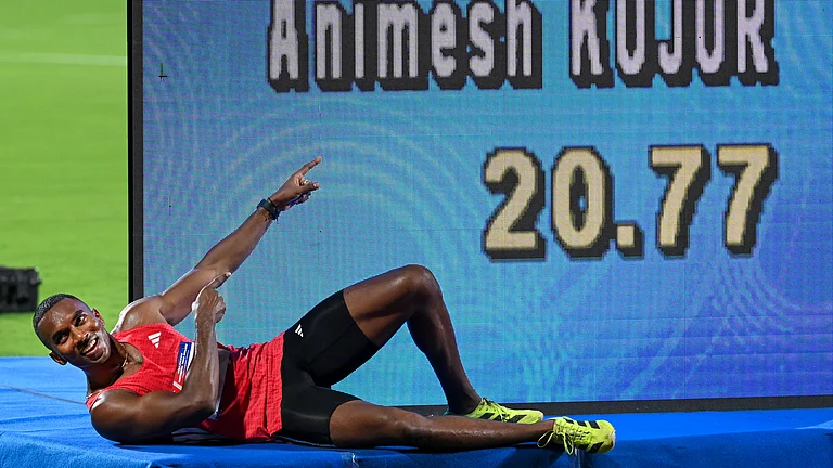 Odisha sprinter Animesh Kujur poses for photographers after finishing first in the men's 200m final at the World Athletics Continental Tour event in Bhubaneswar. - PTI