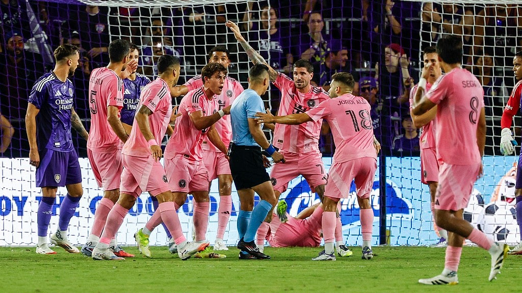 AP : Inter Miami players surround the referee while arguing about a corner kick against Orlando City during their Major League Soccer match in Orlando.