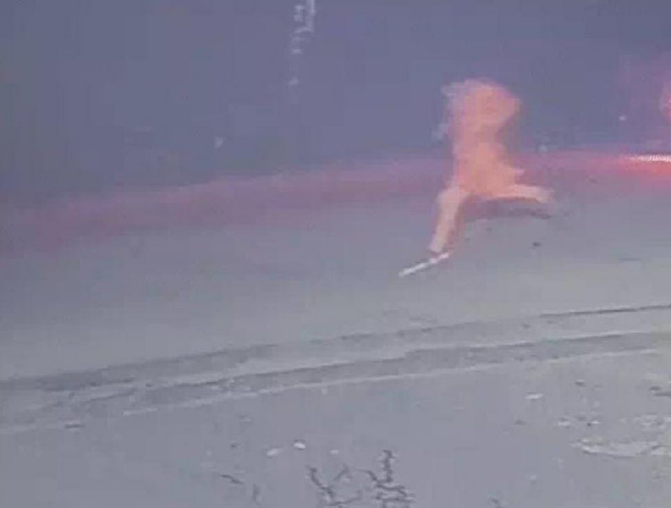 X : Screengrab from CCTV footage shows the woman running on a dimly lit road, looking back as several men on motorcycles pursue her moments before the assault. 