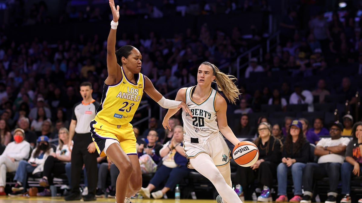 Sabrina Ionescu #20 of the New York Liberty drives to the basket against Azura Stevens #23 of the Los Angeles Sparks during the first quarter at Crypto.com Arena on August 12, 2025 in Los Angeles, California.