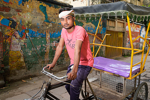 Ravi Kumar, 25, works as a rickshaw driver in Varanasi