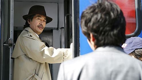 Man standing at the door of the train.