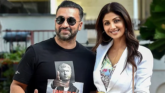 Actor Shilpa Shetty (R) with her husband Raj Kundra (L)