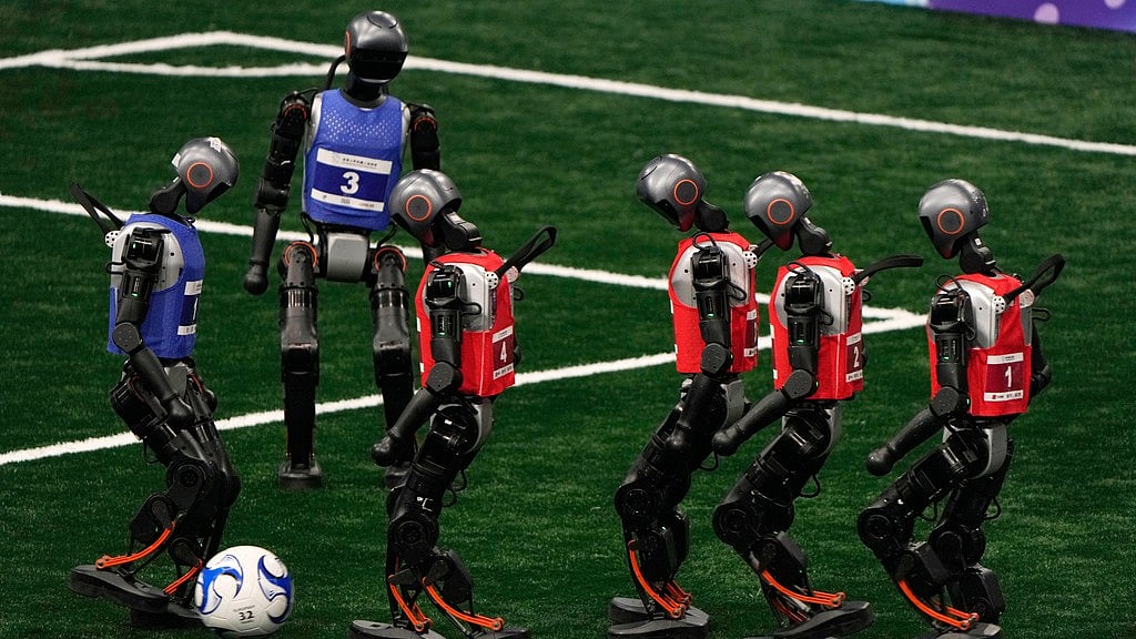 AP : Robots compete in a football event at the World Humanoid Robot Games in Beijing, China on Friday (August 15, 2025).