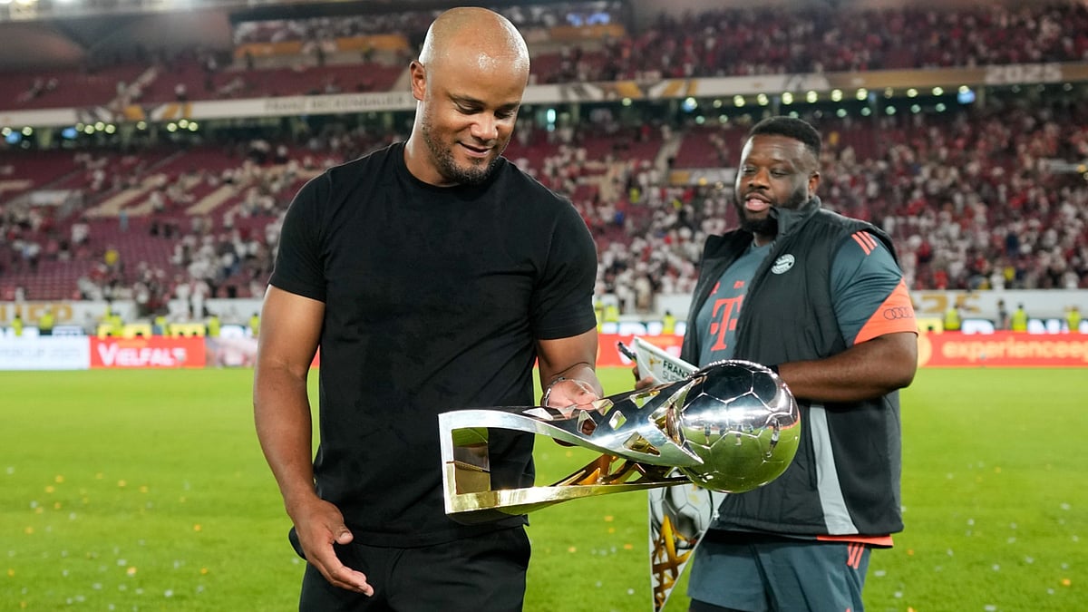 Vincent Kompany holds the German Super Cup.