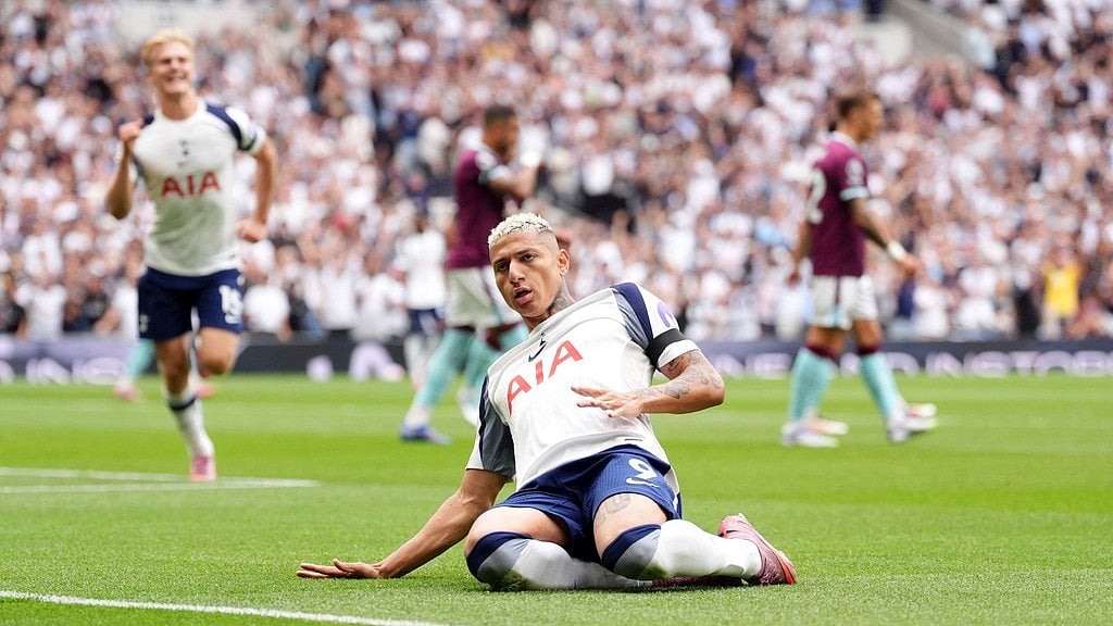 (Adam Davy/PA via AP) : Tottenham Hotspur's Richarlison celebrates scoring the opening goal during the the English Premier League soccer match between Tottenham Hotspur and Burnley at the Tottenham Hotspur Stadium in London, Saturday, Aug. 16, 2025. 