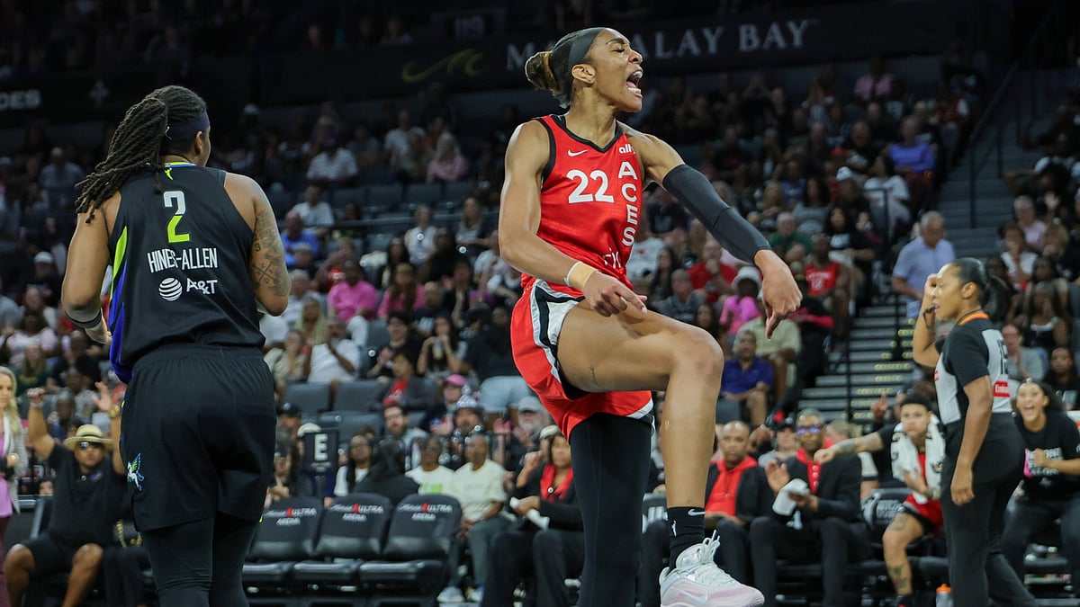 A'ja Wilson #22 of the Las Vegas Aces reacts after scoring a basket and drawing a foul against the Dallas Wings in the first period of their game at Michelob ULTRA Arena on August 17, 2025 in Las Vegas, Nevada. - null