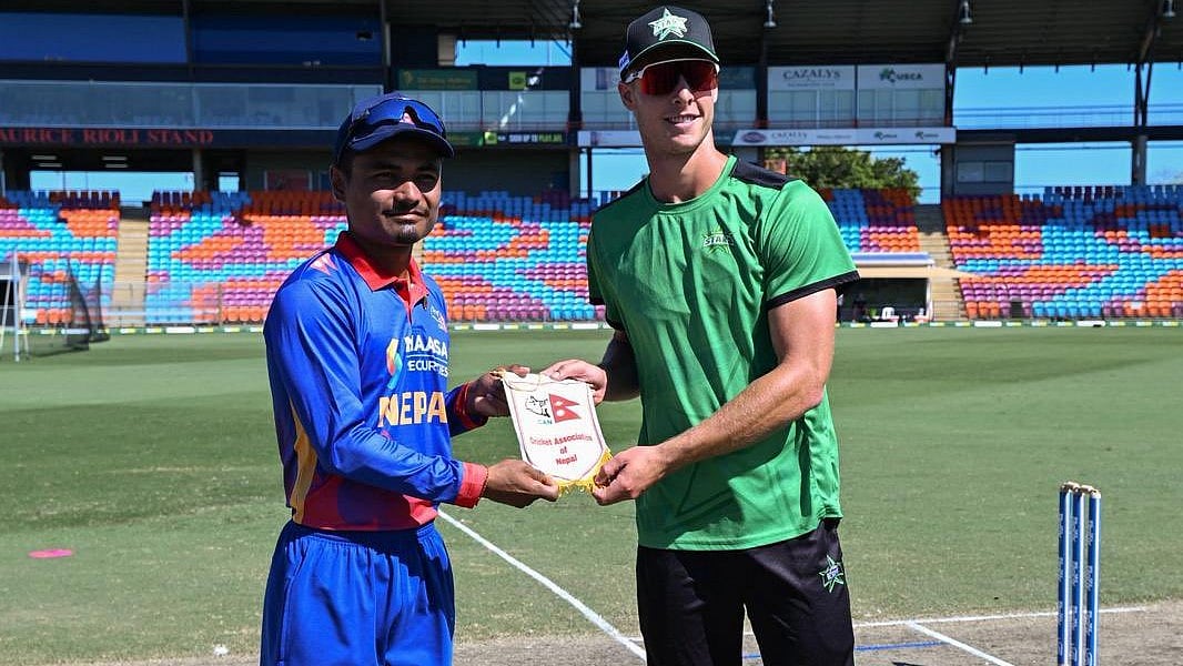 | Photo: X/CricketNep : Nepal vs Melbourne Stars Academy, Top End T20 Series 2025: Nepal's Rohit Kumar Paudel and Melbourne Star Academy's Campbell Kallaway ahead of the match.