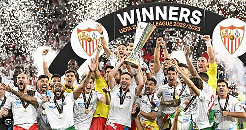 The winning team lifting the trophy