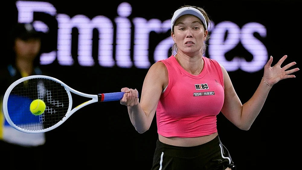 | Photo: AP/Vincent Thian : Danielle Collins plays a forehand return to Destanee Aiava