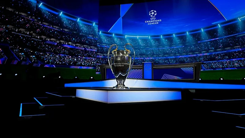 Champions League trophy is displayed.