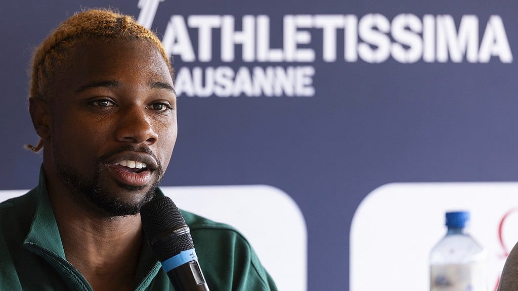 Cyril Zingaro/Keystone via AP : Noah Lyles speaks during a press conference on the eve of the Diamond League 2025 athletics meeting in Lausanne, Switzerland.