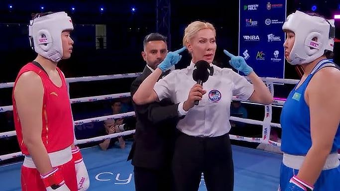 The referee is explaining the rules to both bowers