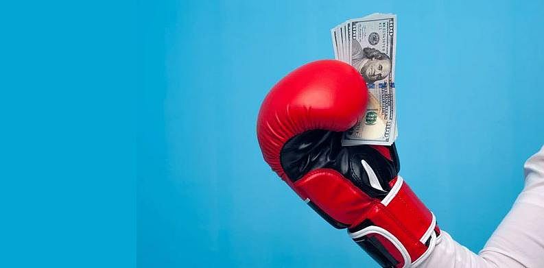 Boxing Glove holding some cash