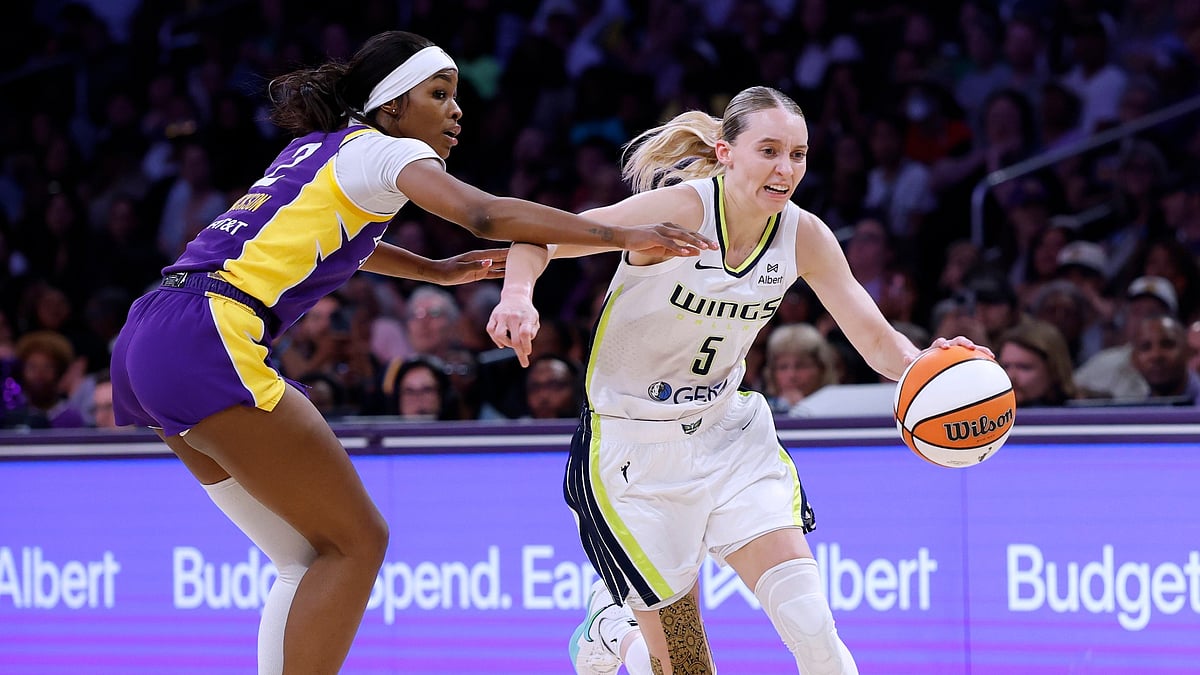 Paige Bueckers #5 of the Dallas Wings drives past Rickea Jackson #2 of the Los Angeles Sparks during the first half at Crypto.com Arena on August 20, 2025 in Los Angeles, California.