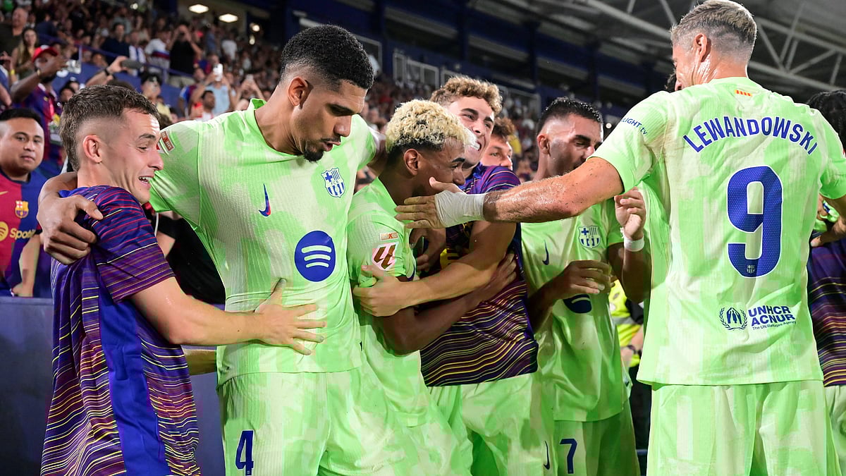 Barcelona celebrate their late goal against Levante