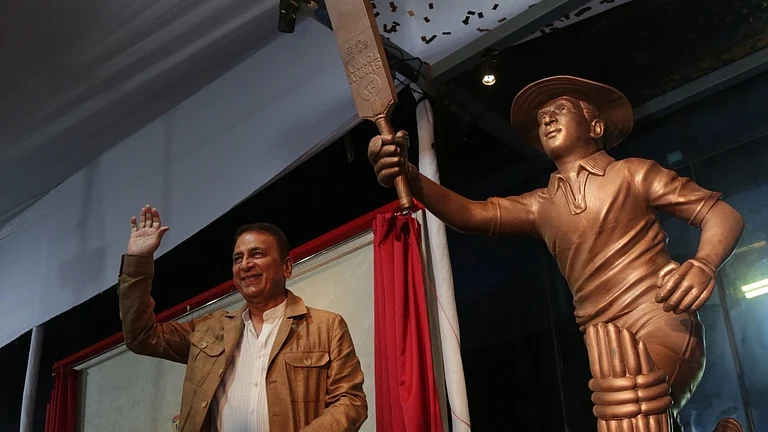 Sunil Gavaskar poses alongside his new statue - Special Arrangement