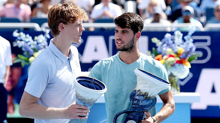 Jannik Sinner and Carlos Alcaraz pictured after the former retired from the Cincinnati Open final - null