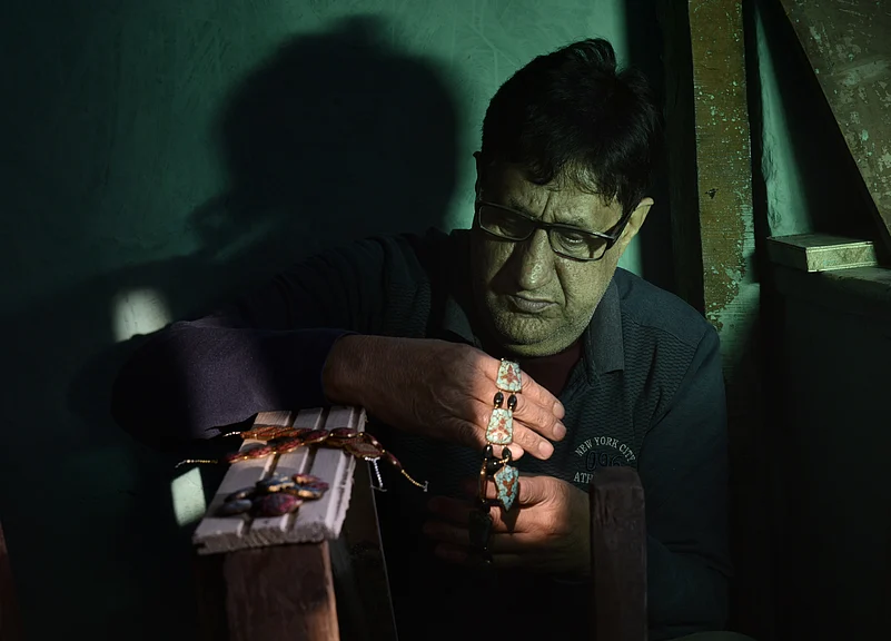 A Kashmiri handicraftsman hard at work