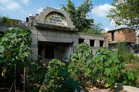 A broken community toilet in the Savda Ghevra JJ colony. 