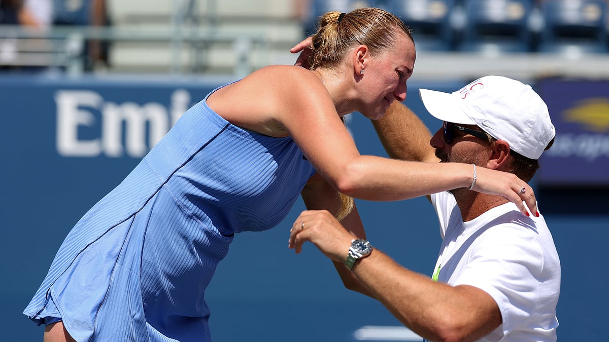 Petra Kvitova embraces her coach and husband Jiri Vanek